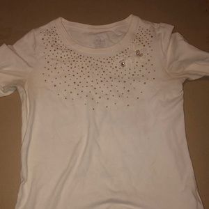 This is a cream and gold shirt